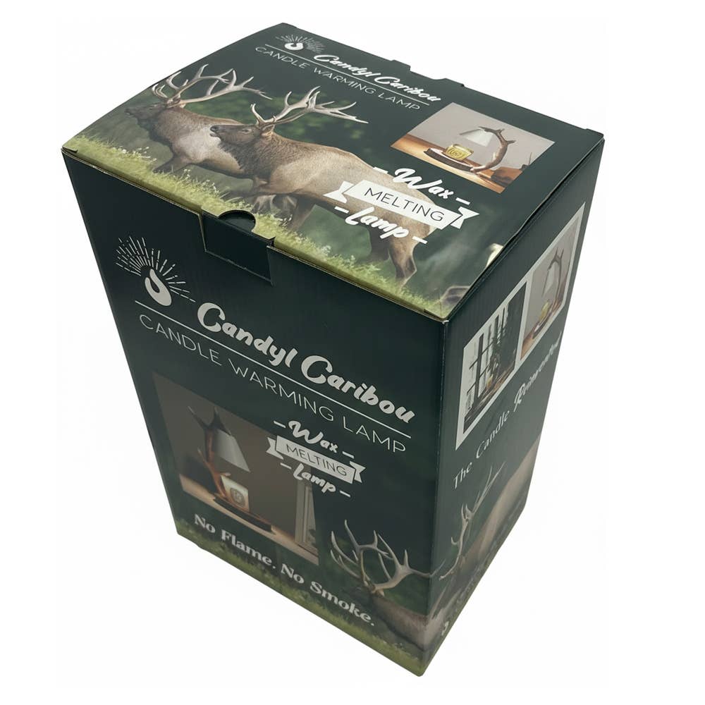 Candyl Caribou Candle Warming Lamp retail box shown at an angle on a plain white background. The packaging is dark green with white text and features an image of deer in the grass on the top panel.