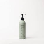 Guests on Earth Rain Soap in a matte sage green pump bottle with a black dispenser, centered on a clean white background.