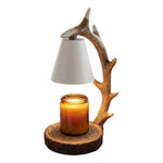 Candle holder with antler design on a white background