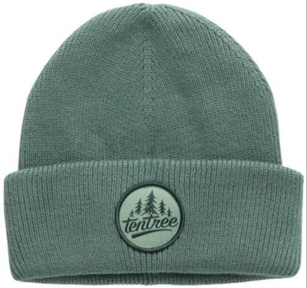 A sage green ribbed knit beanie hat with a folded cuff, featuring a circular embroidered Tentree logo patch on the front.